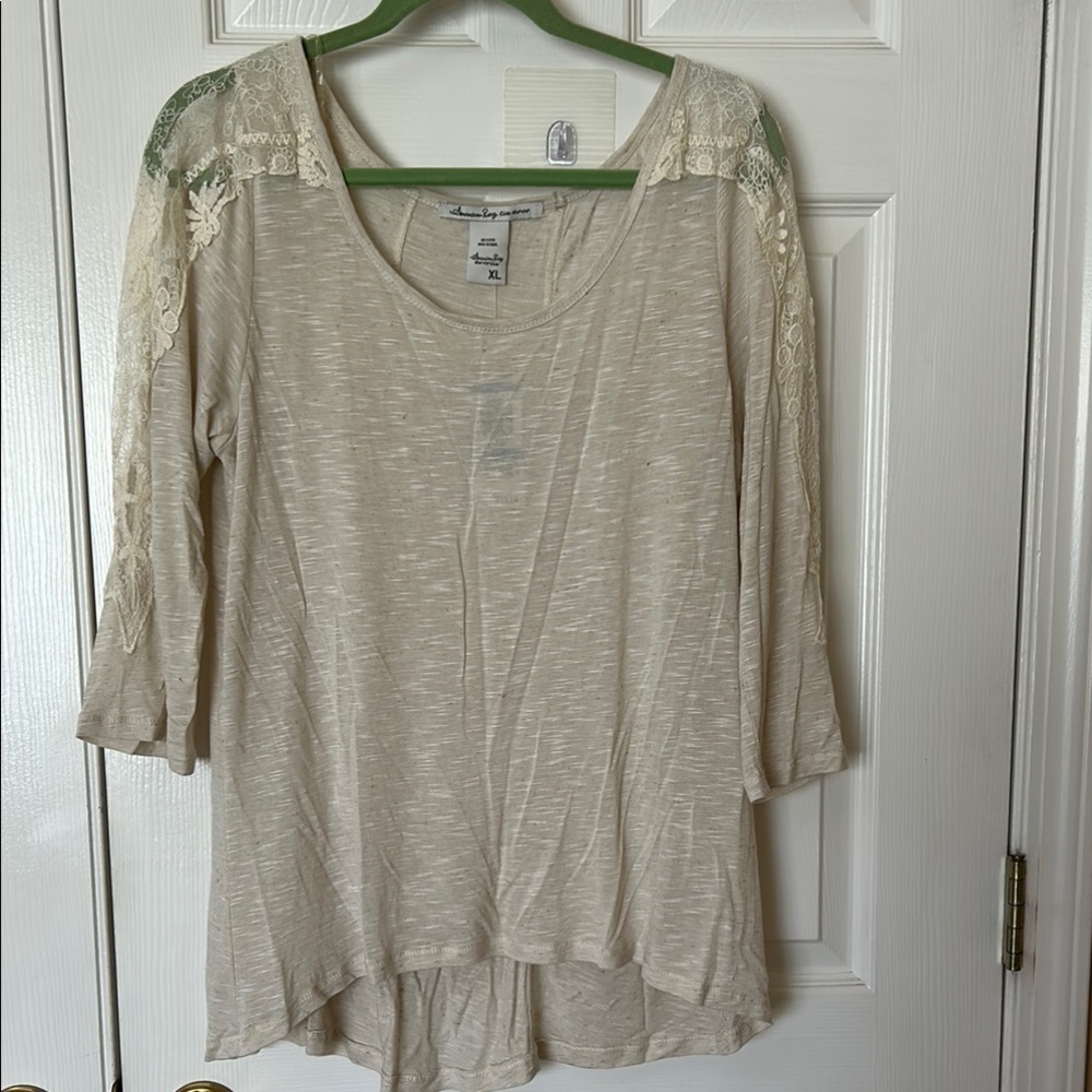 American Rag Cie Women's Cream Top with Lace Accents High Low. NWT